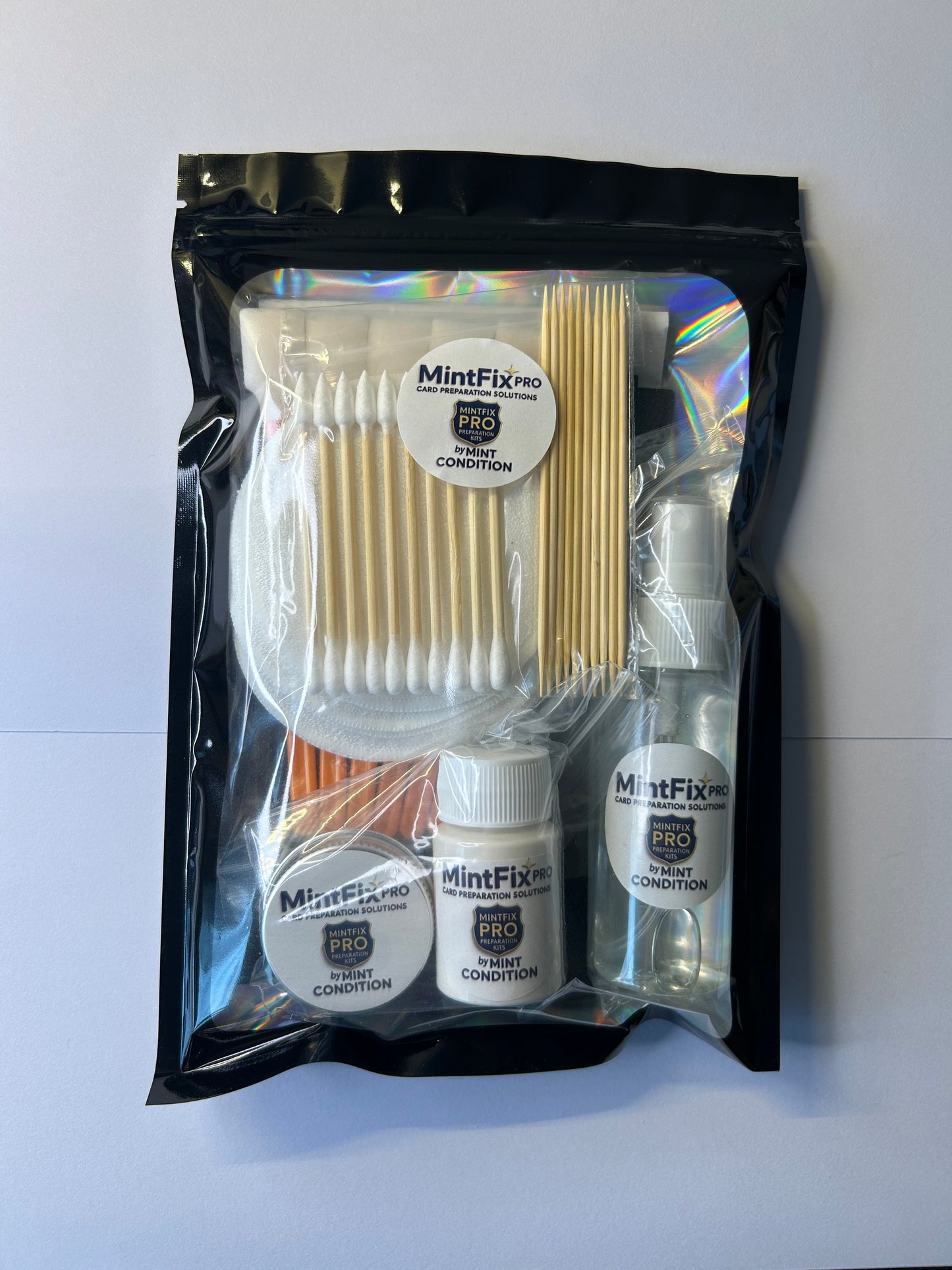 Premium trading card maintenance kit with microfibre cloths and cleaning tools